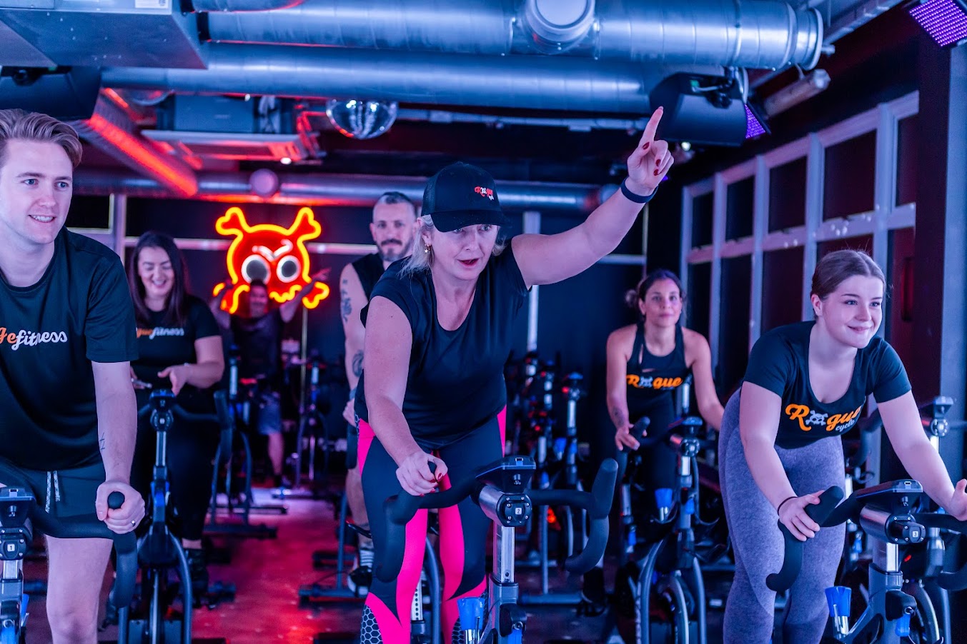 A Rogue Cycle indoor cycling class in session
